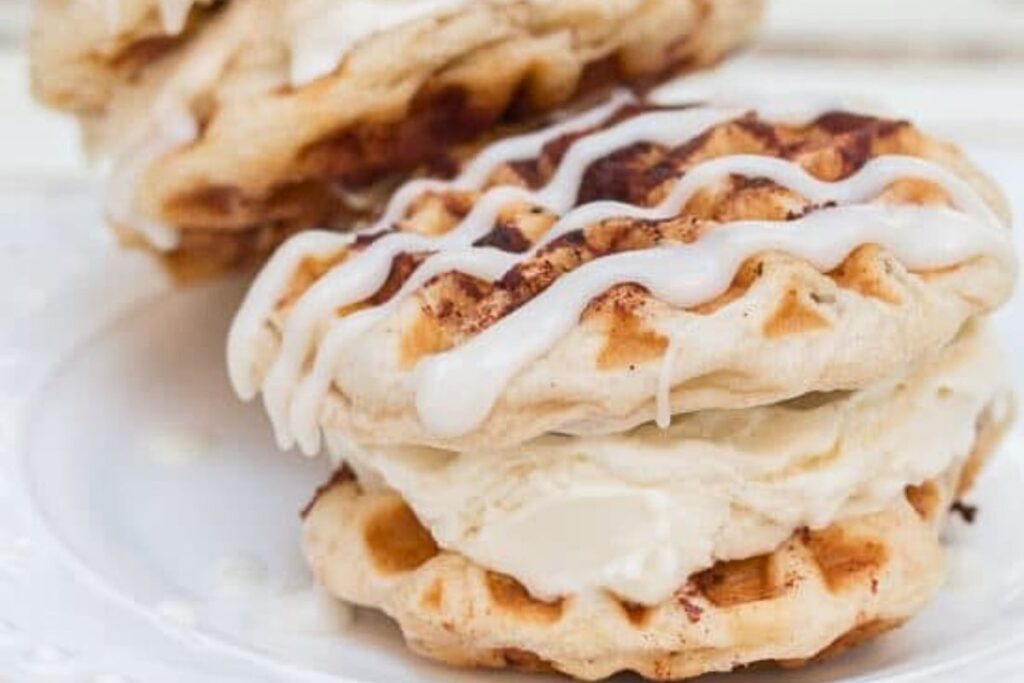 An ice cream sandwich made of waffled cinnamon rolls.