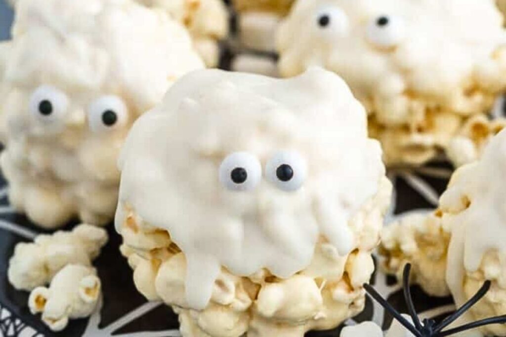 Popcorn balls with a delicious candy melt coating with eyes.