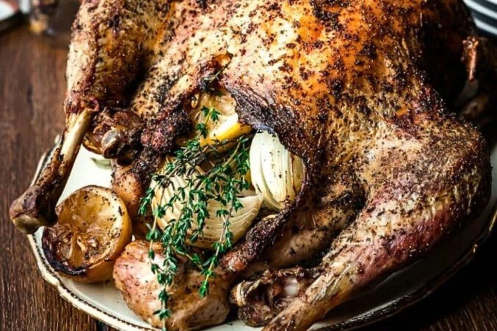 A stuffed and roasted turkey on a platter.