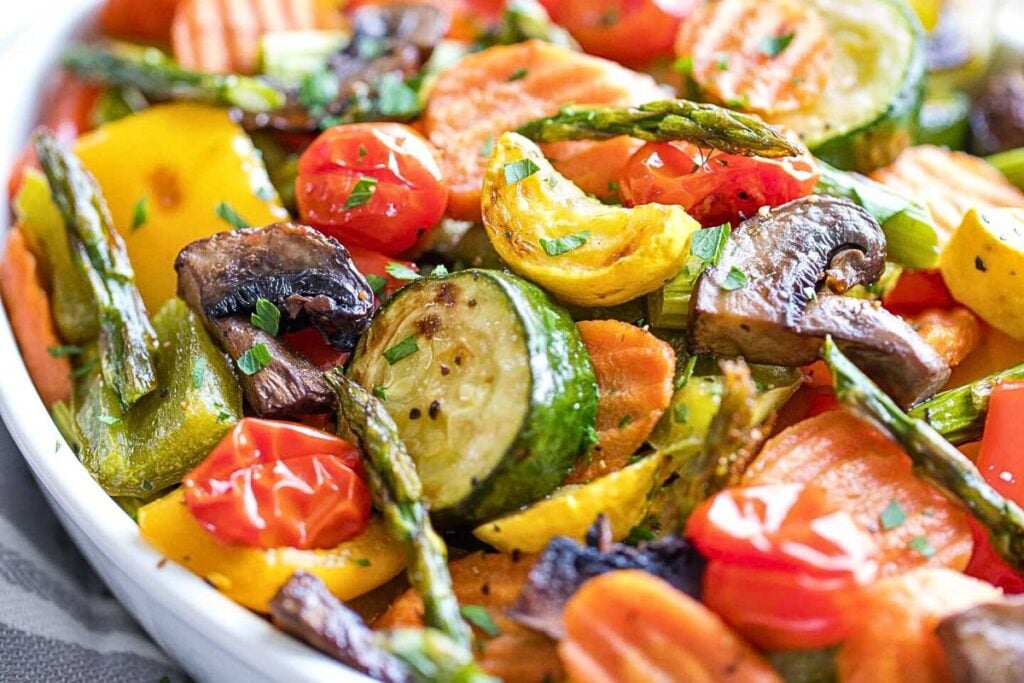 A serving dish filled with roasted veggies.