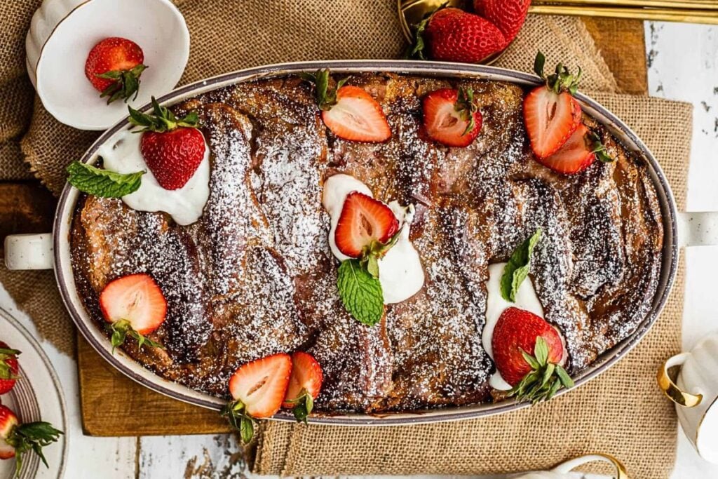 A casserole of french toast casserole with strawberries.