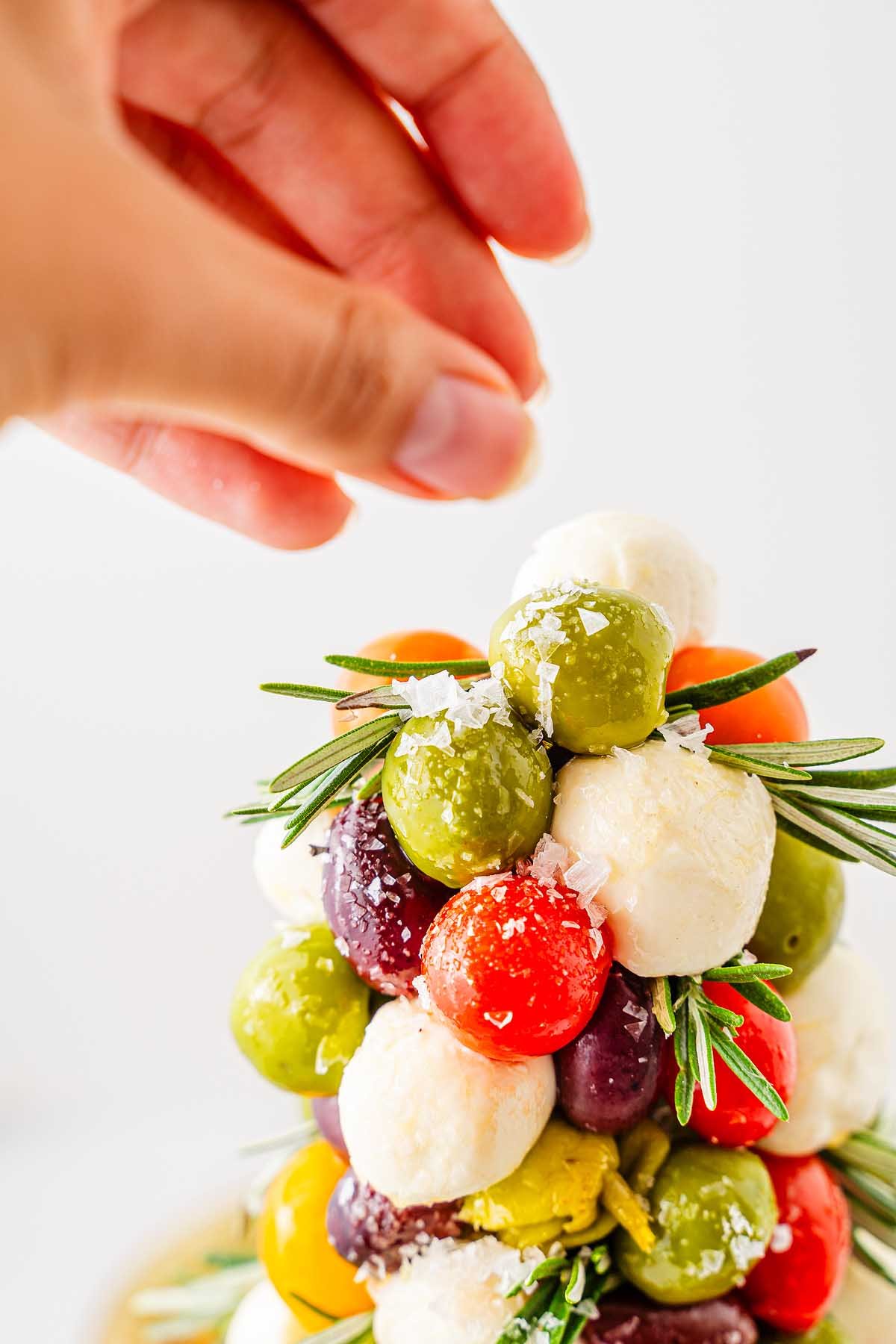 Flake salt sprinkled on finished holiday appetizer decoration.