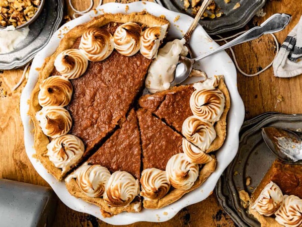 Sweet potato pie with a slice missing.