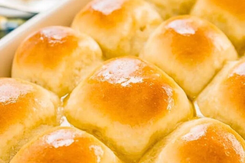 A baking dish with golden brown yeast rolls.