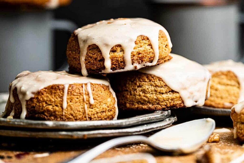 A plate of maple biscuits with creamy brown butter glaze.