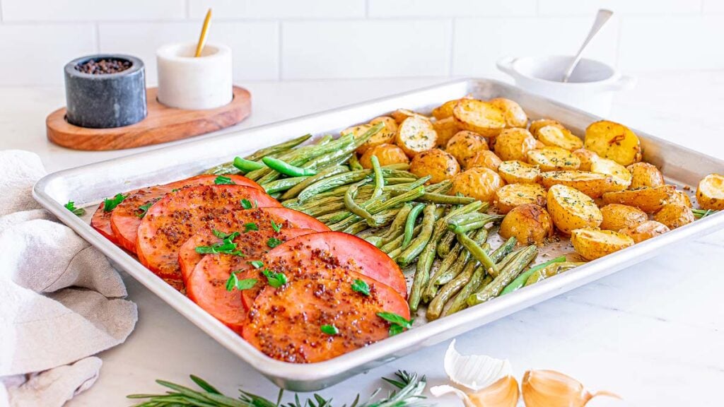 A holiday sheet pan ham dinner recipe for Easter, Thanksgiving or Christmas.