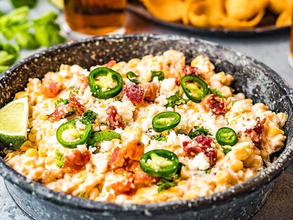 A corn an jalapeno dip in a bowl.