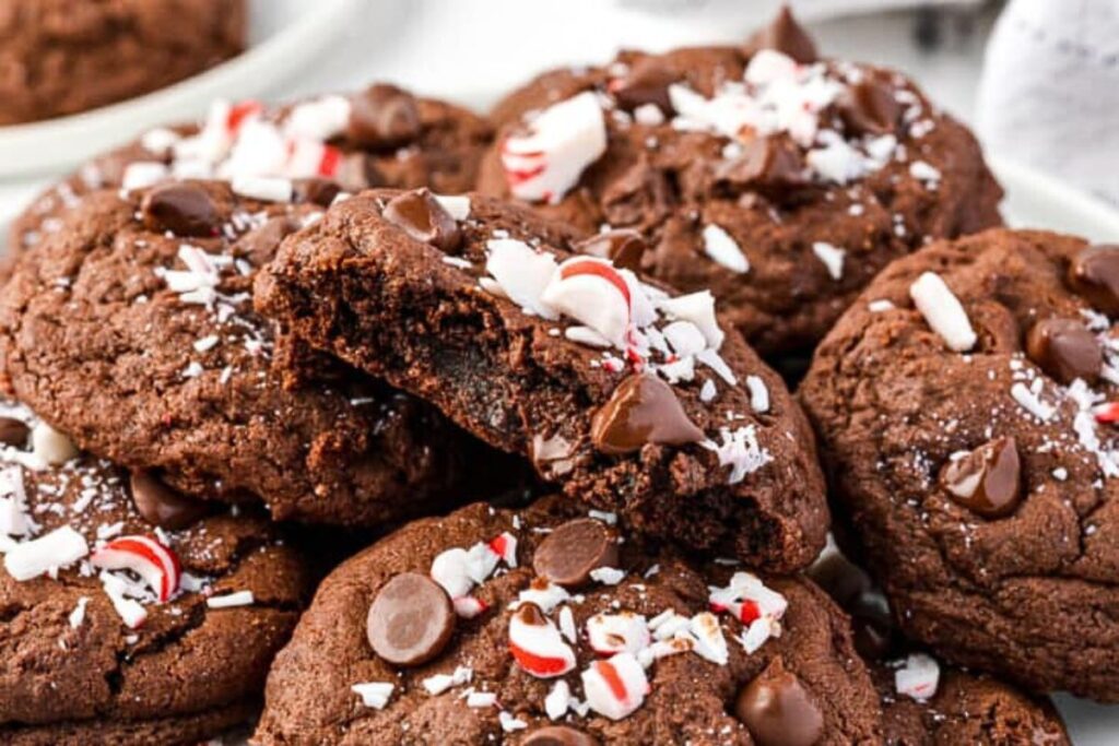 A plate of double chocolate chip cookies with candy canes.