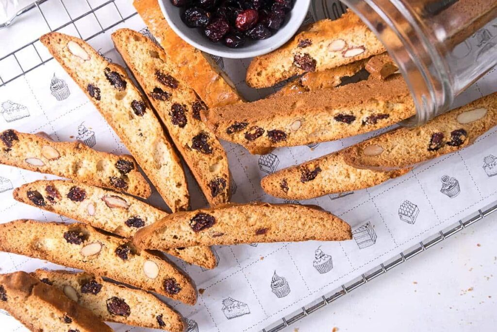 A cooling rack filled with cranberru biscotti.
