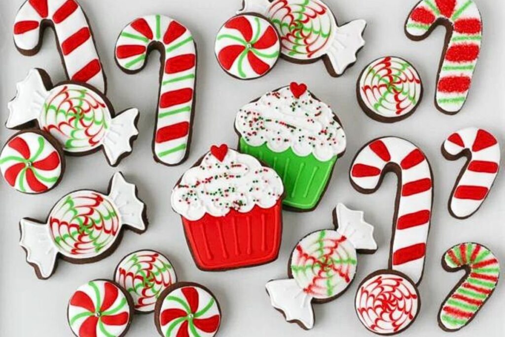 Christmas cookies that are decorated to look like candy canes and peppermint candies.