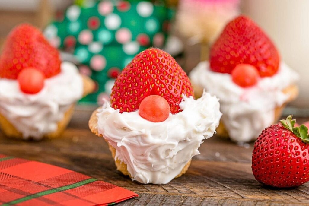 Cookie cups with strawberry hats and gnome faces.