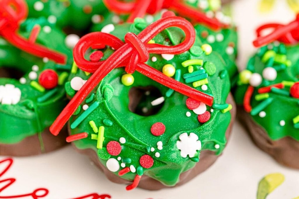 Marshmallow cookies decorated to look like Christmas wreaths.