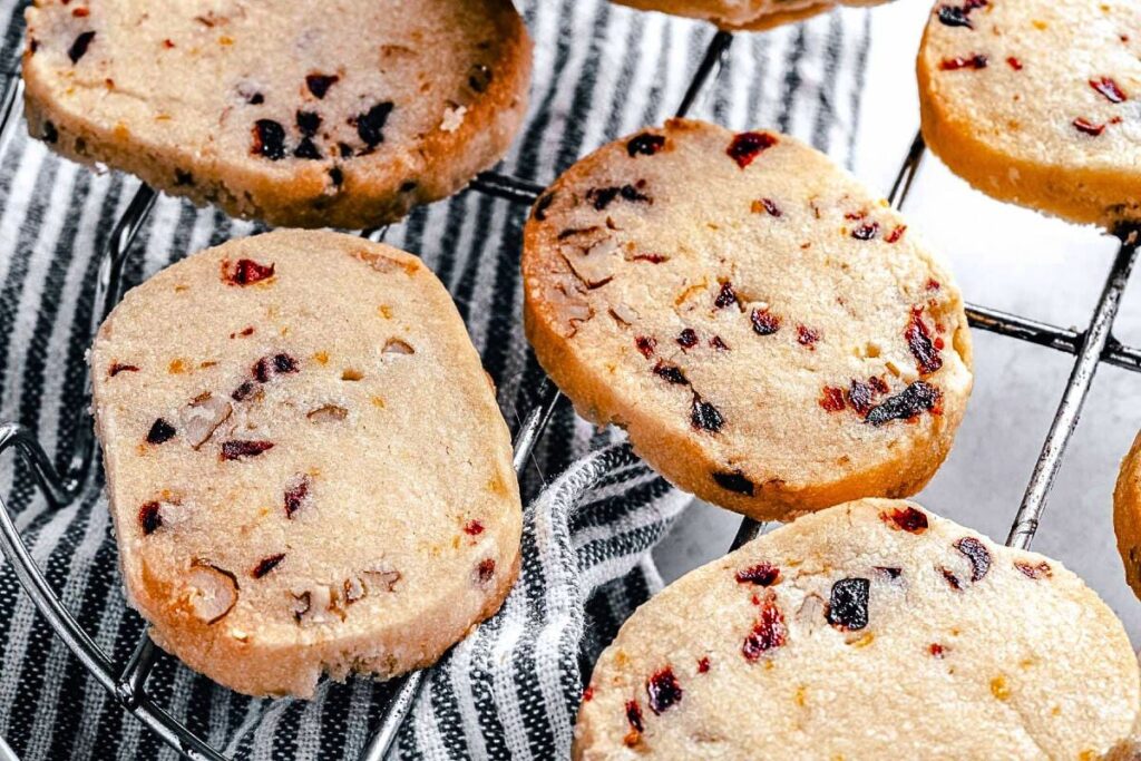 Cranberry pecan shortbread cookies on a cooling rack.