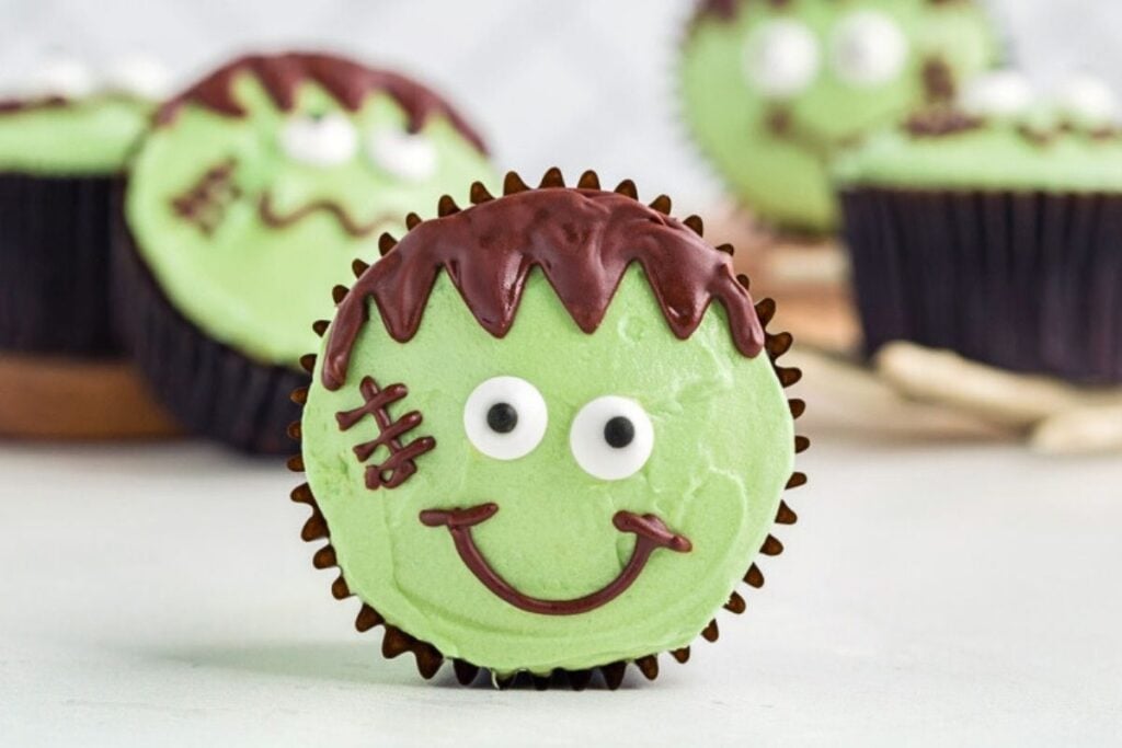 Cupcakes decorated to look like Frankenstein's face.