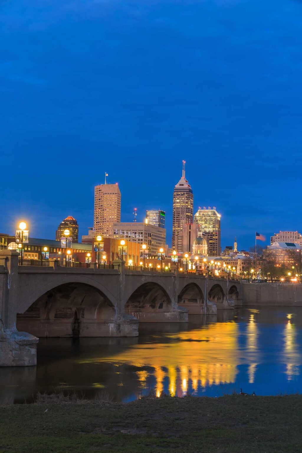 Indianapolis skyline and the White River at twilight.