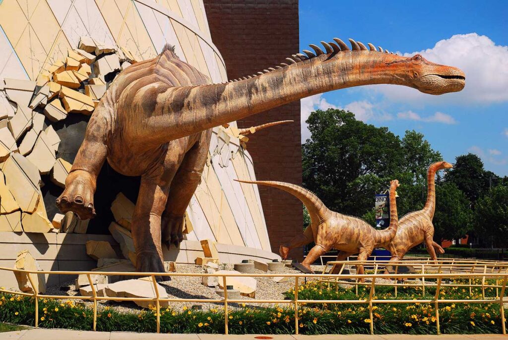 A dinosaur "breaks out" of the wall at the Indianapolis Children's Museum in Indianapolis, Indiana.