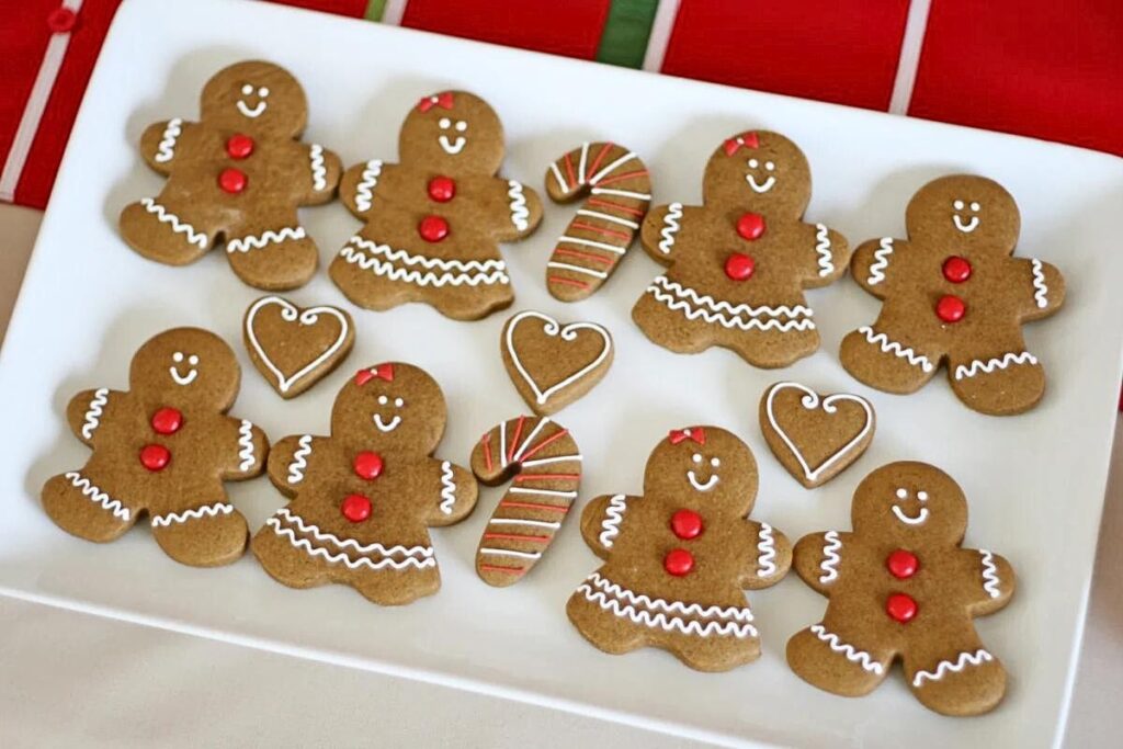 A baking sheet of decorated gingerbread man cookies.