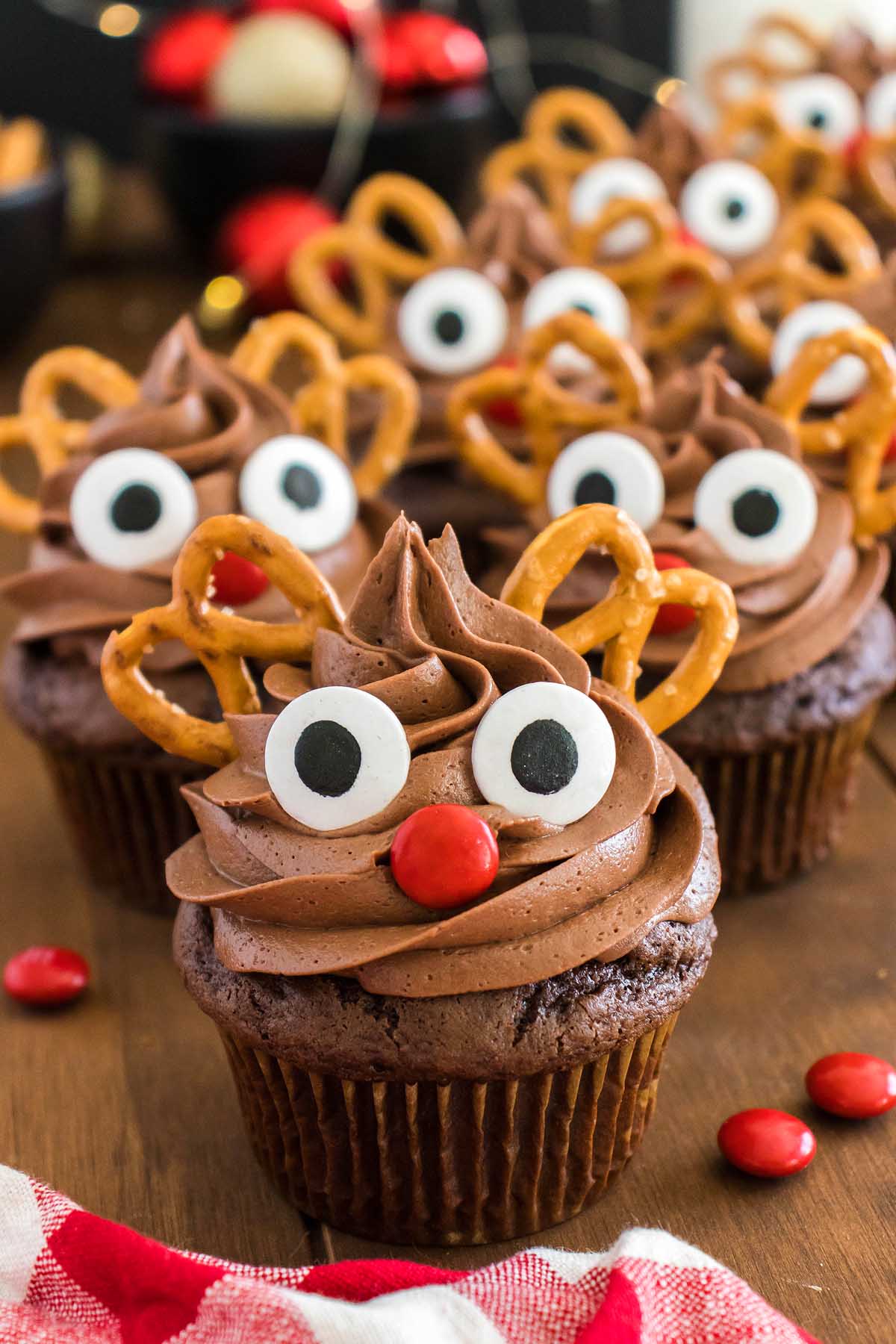 Rudolph cupcakes with pretzels on top.