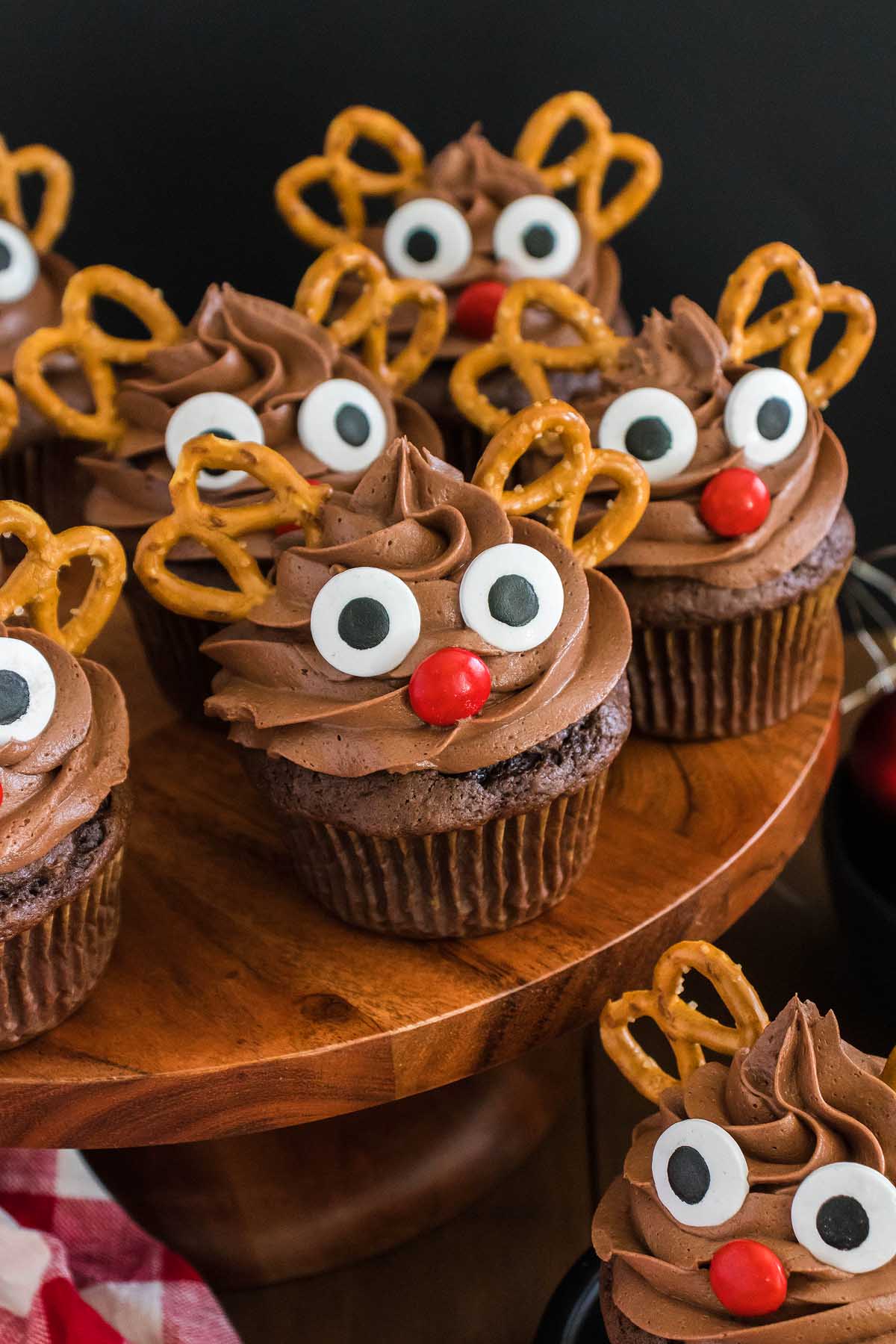 Christmas cupcakes with pretzel noses, featuring adorable reindeer designs.