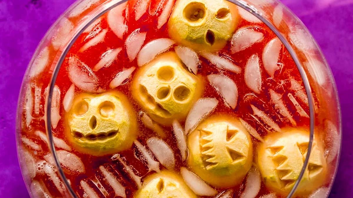 Red punch with shrunken head apples.