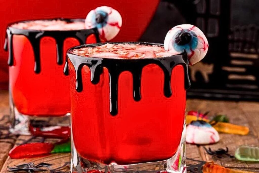 A blood red punch with candy eye garnish.