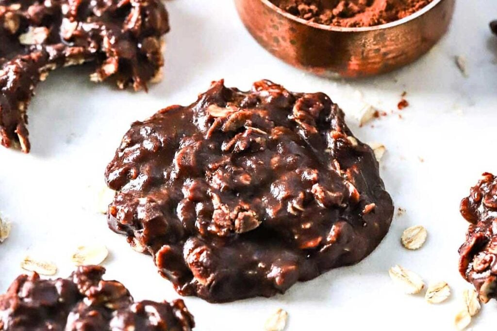 Easy no bake chocolate peanut butter cookies with oats on white table.