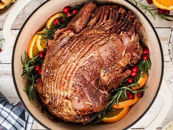 A ham cooking in a dutch oven.