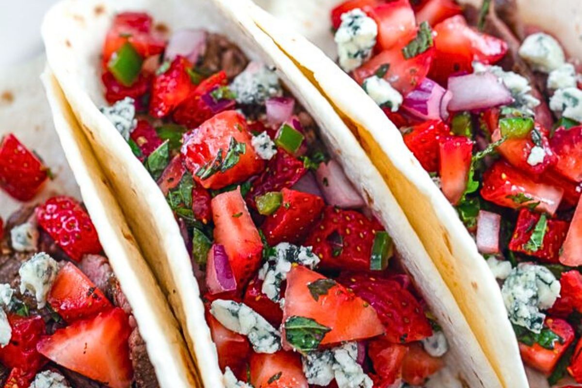 Tacos made of flank steak and berries.