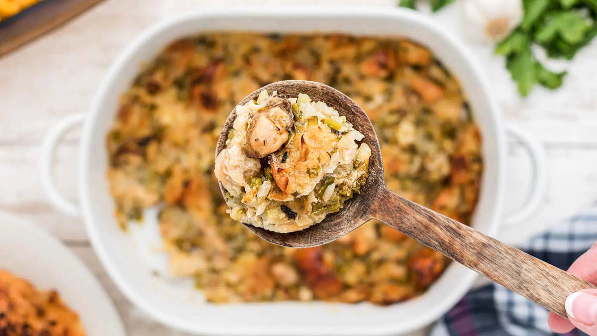 A spoon scooping dressing.