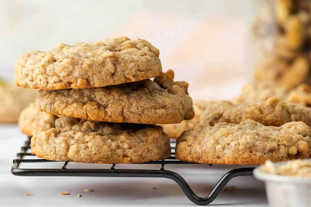 A round-up of gluten-free oatmeal cookies on a cooling rack.