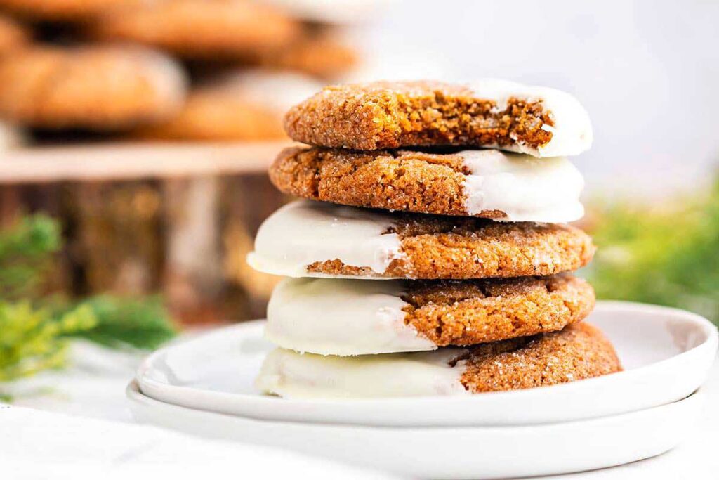 A stack of gingerbread cookies with icing on top.