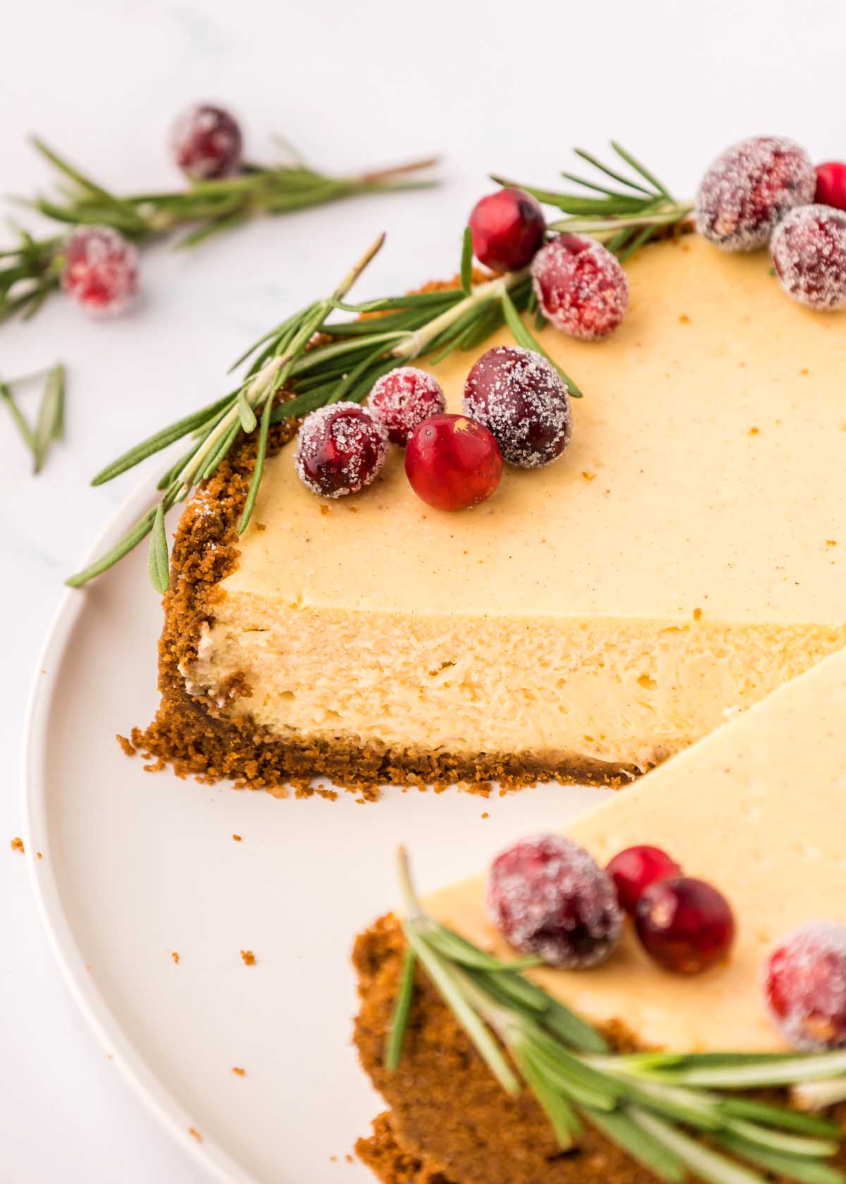 A festive dessert that combines the creamy indulgence of eggnog cheesecake with the tartness of cranberries and a hint of refreshing rosemary. Perfect for Christmas celebrations.