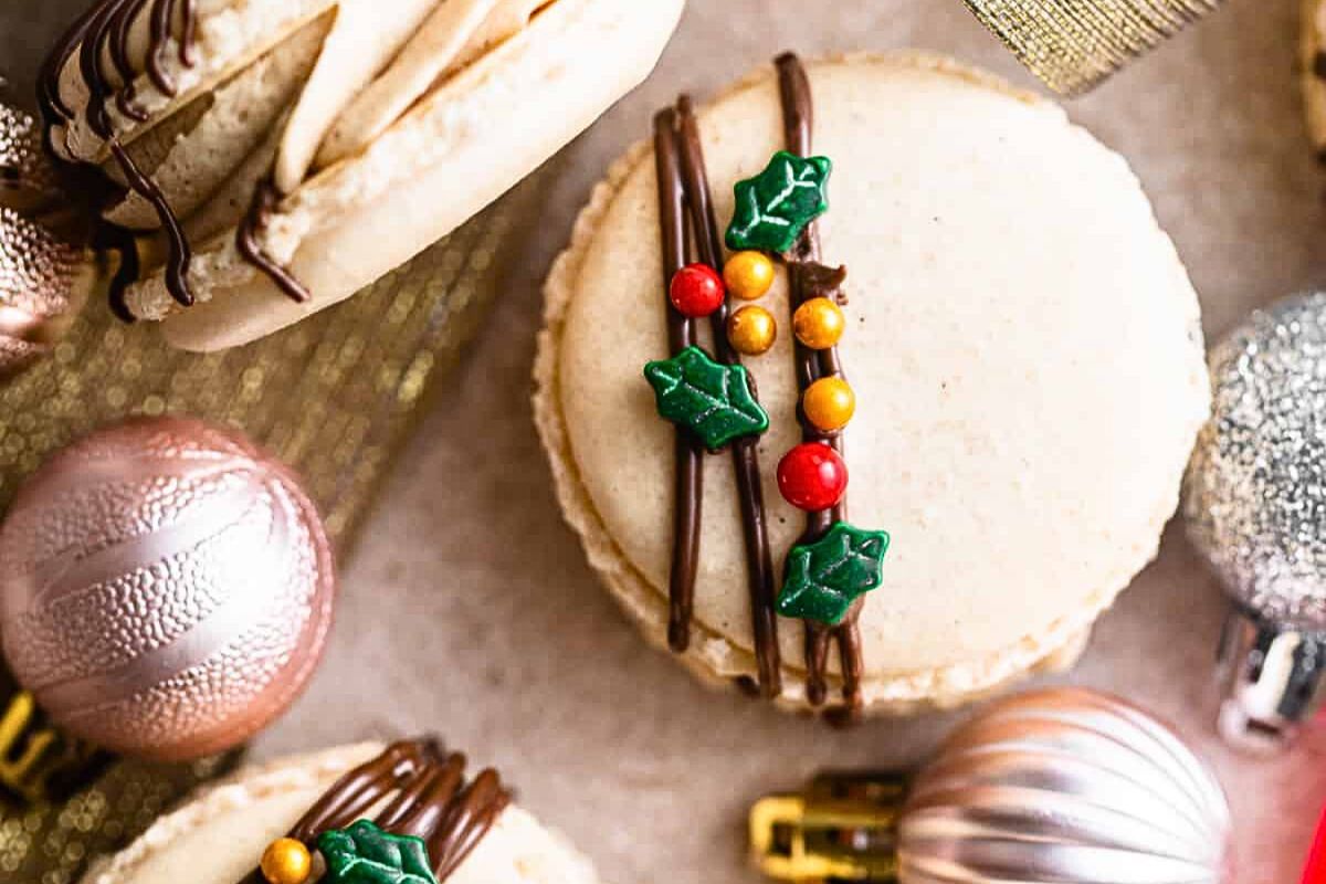 Gingerbread macarons, decorated for Christmas.