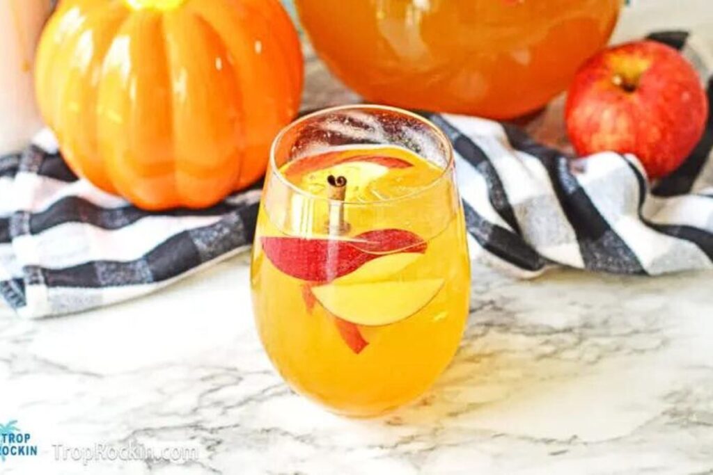 A glass of sangria made with pumpkin pie flavors.