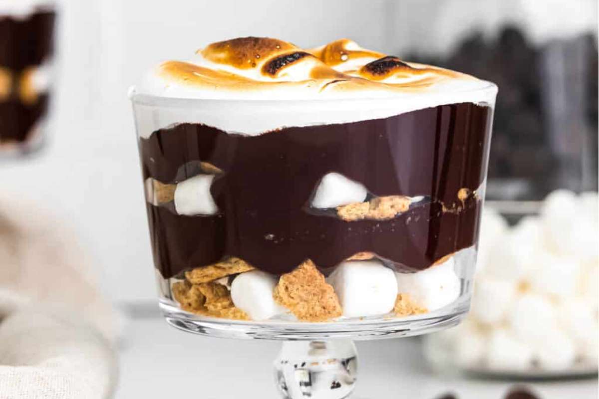Chocolate s'mores trifle in a glass with marshmallows.