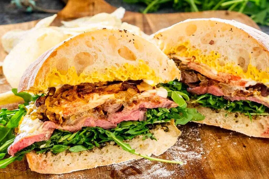 A slice of a steak sandwich.