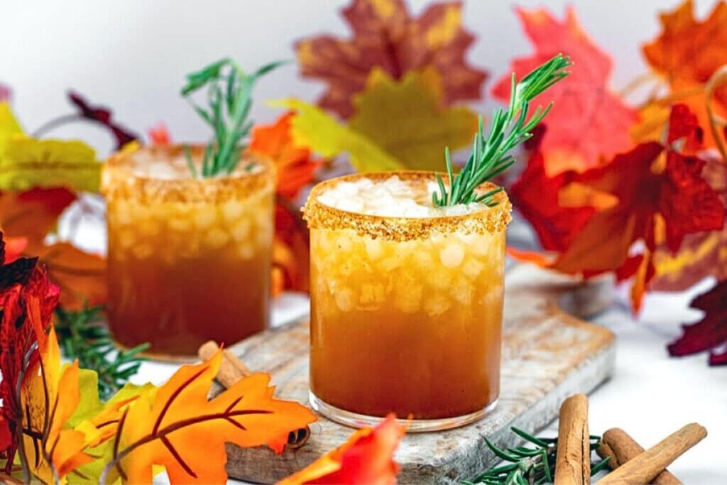 Glasses of apple cider and pumpkin margaritas.