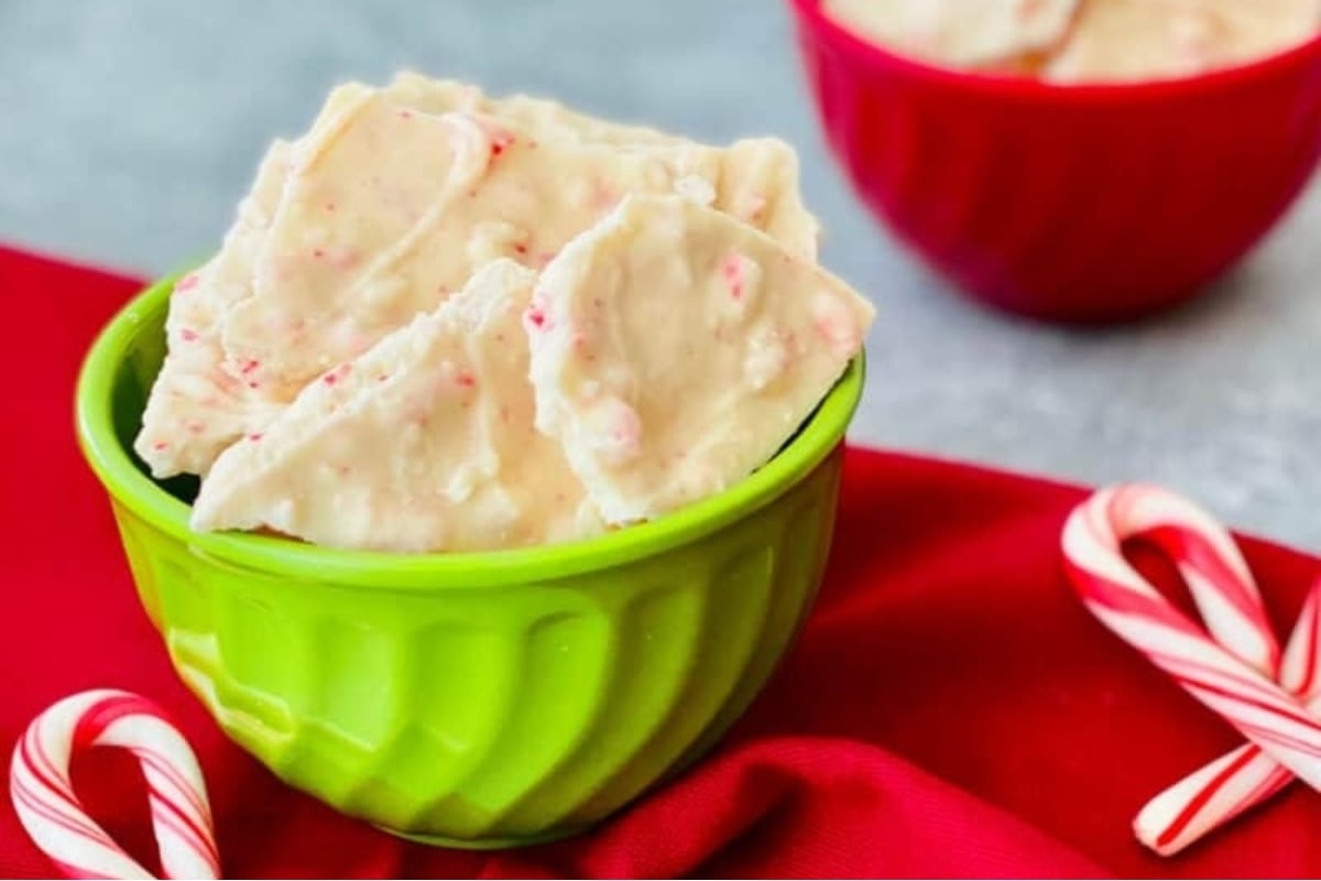 Peppermint candy cane bark in a green bowl.