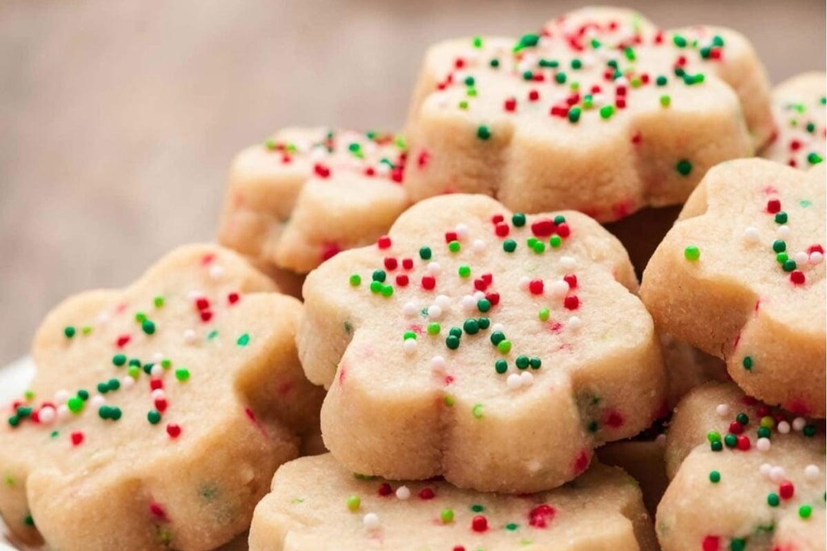 A pile of cookies with *freezable cookie recipes* and sprinkles on top.