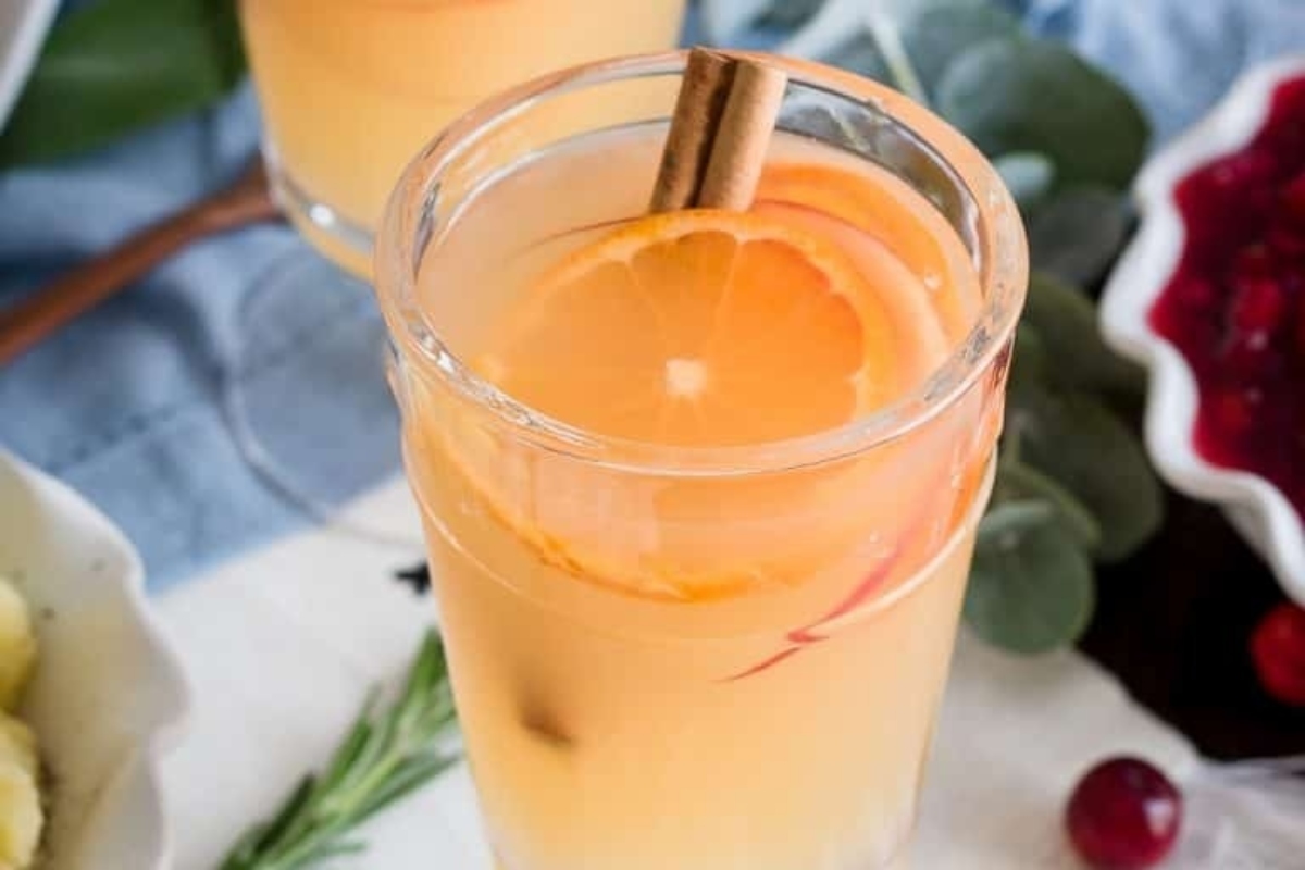 A glass of cranberry mulled wine with cinnamon sticks, perfect for Christmas cocktails.