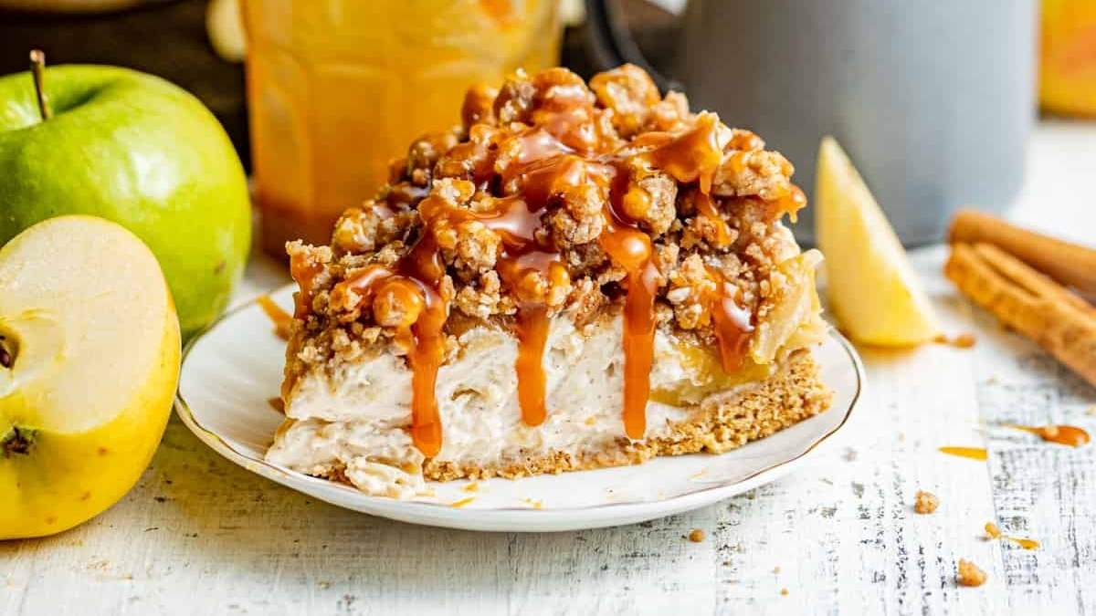 A delectable slice of apple pie drizzled with rich caramel sauce.