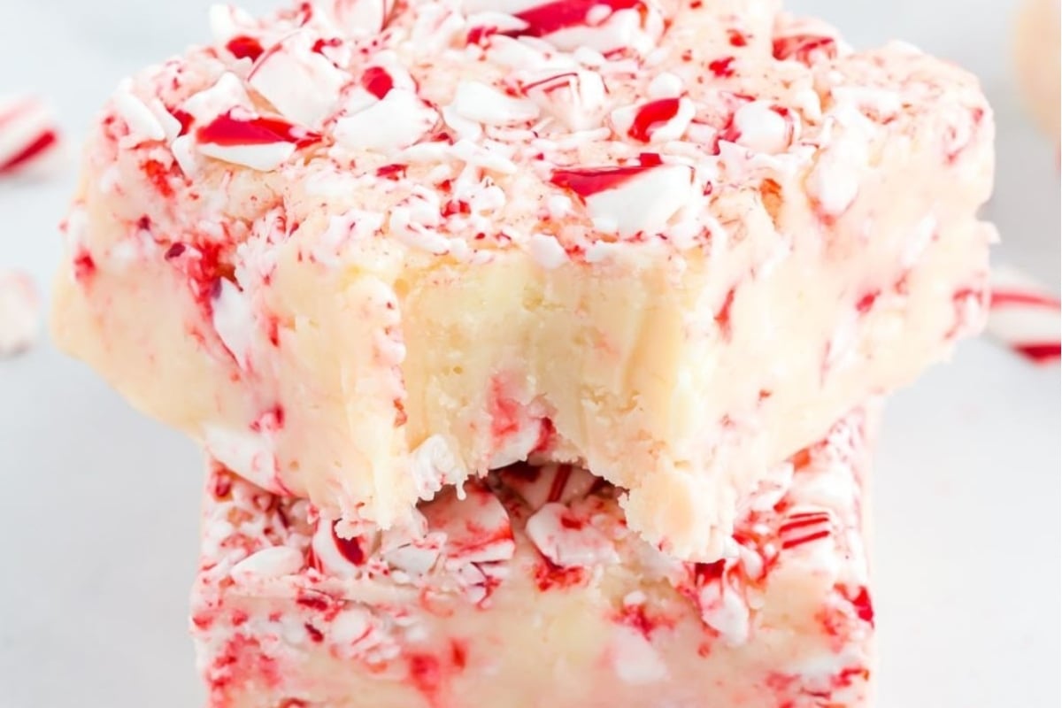 Peppermint fudge and candy cane recipes are stacked on top of each other.