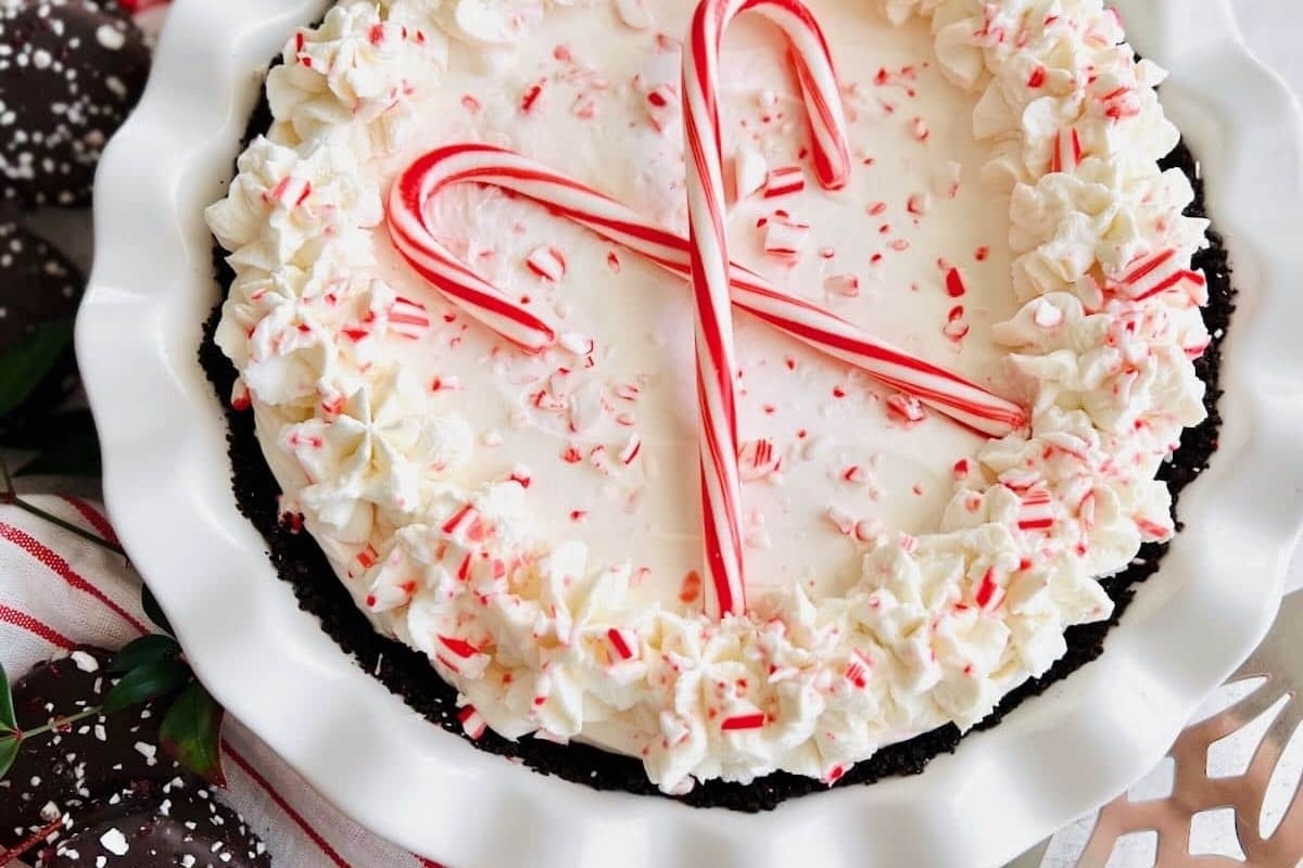 A delectable chocolate pie adorned with candy canes.