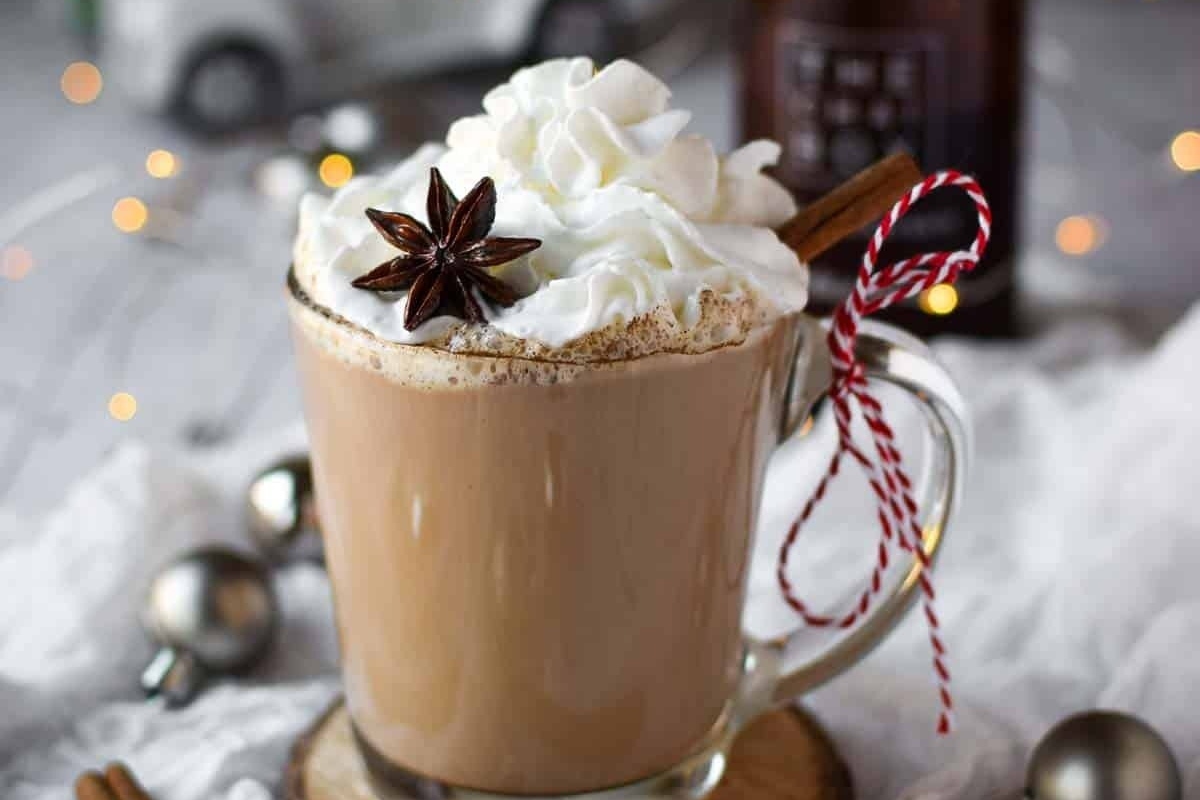 A cup of hot cocoa with cinnamon and star anise, perfect for cozy winter nights.
