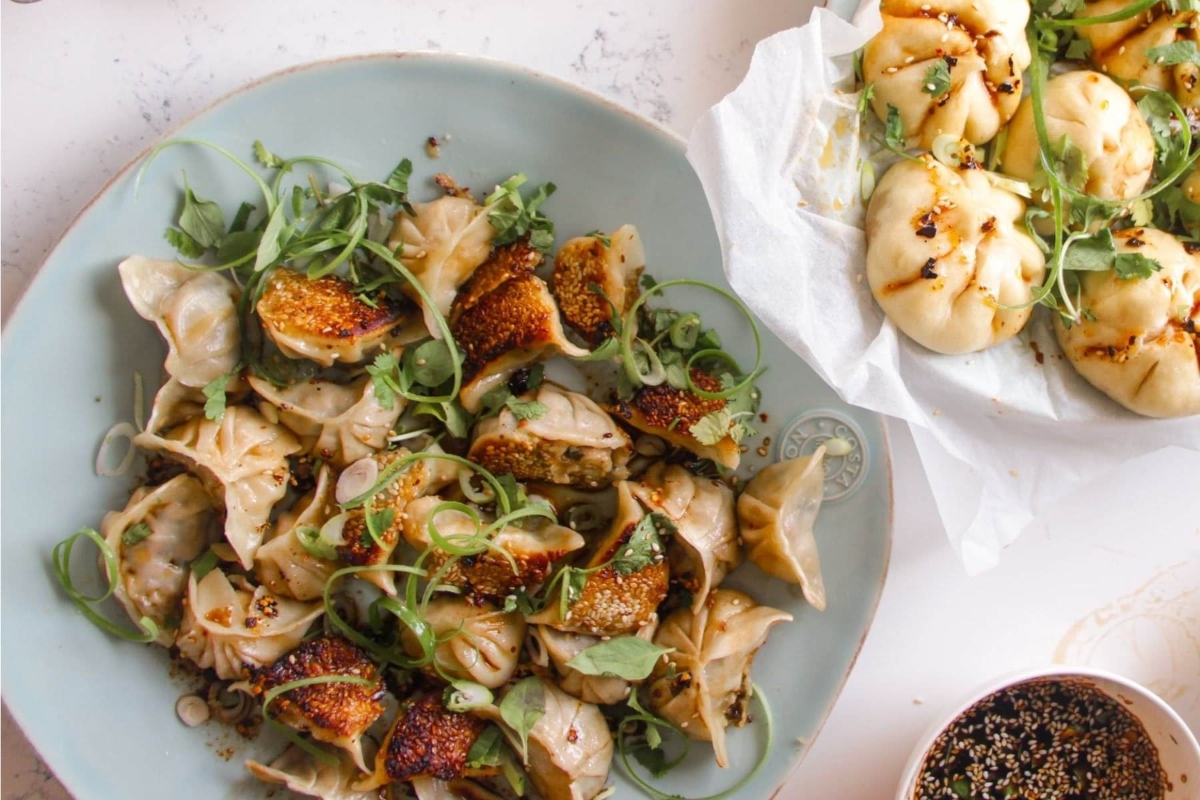 A tantalizing plate featuring dumplings and vibrant greens, perfect for your festive New Year's Eve meal.