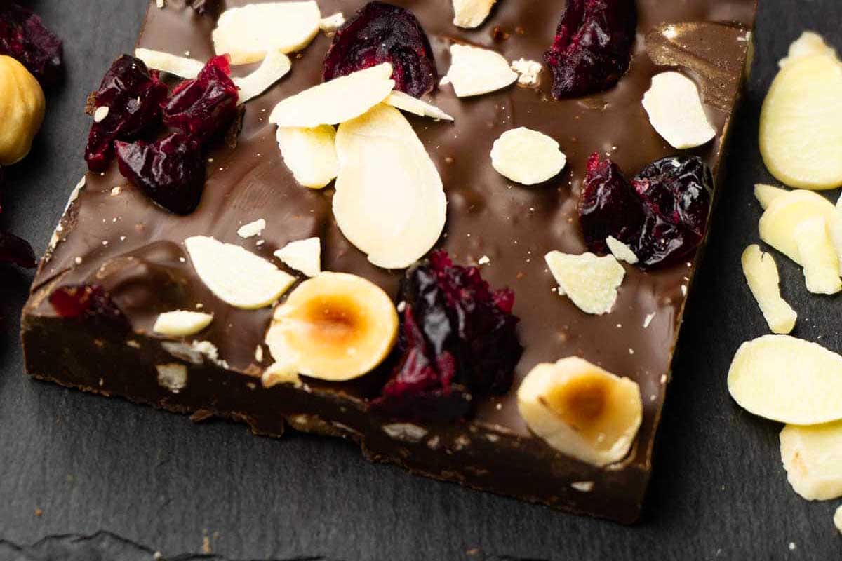 A delightful Christmas bark recipe featuring chocolate fudge with almonds and cranberries.