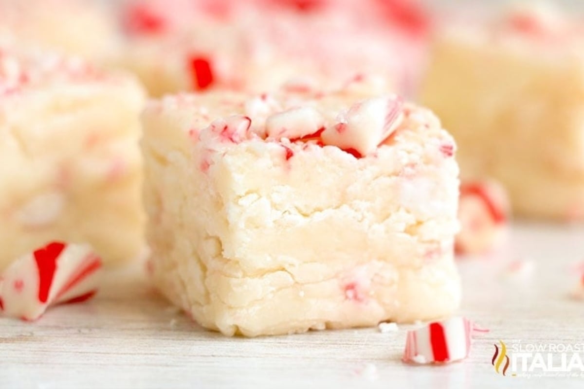 Peppermint fudge squares on a white surface.