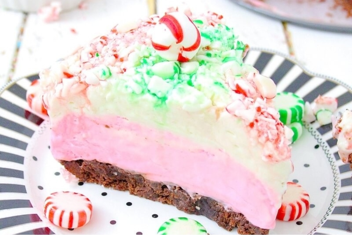 A festive candy cane ice cream pie on a plate, perfect for holiday gatherings.