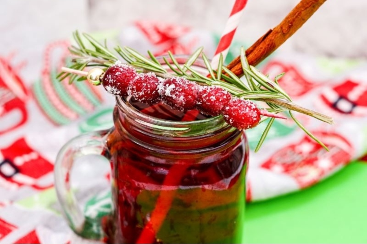 A jar of mulled wine with cranberries.