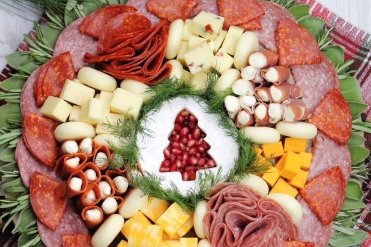 A make ahead holiday platter featuring a Christmas selection of meats and cheeses.